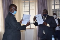 The signing of the contract for the Uganda Driver Licensing System between Ministry of Works & Transport and Uganda Security Printing Company (USPC)