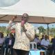 The Minister of State for Transport, Hon. Julius Wandera Maganda, addresses Project Affected Persons (PAPs) during an engagement on delayed compensation in Bukasa on Friday, 23 October 2026.